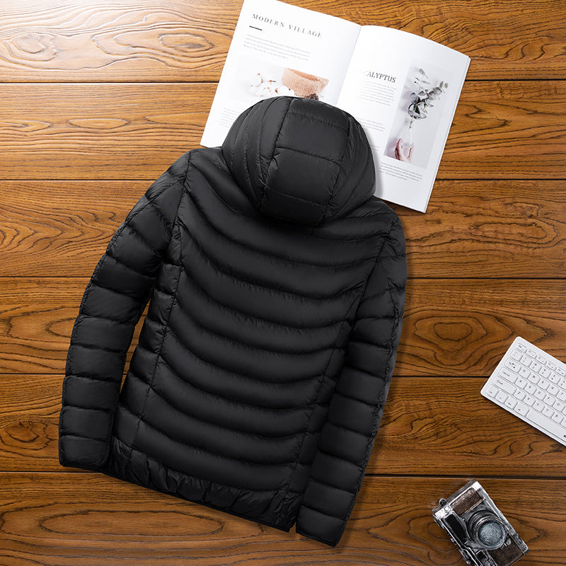 Premium Women's Heated Jacket in black, featuring a detachable hood and ultra-fine carbon fiber heating panels.