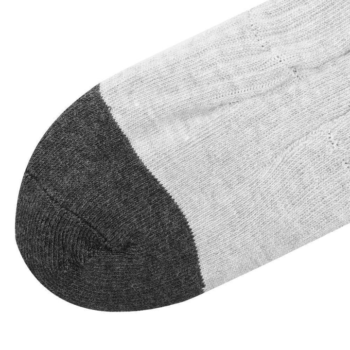 Close-up of Savior Heated Socks with a gray toe and white body, designed for warmth and comfort.